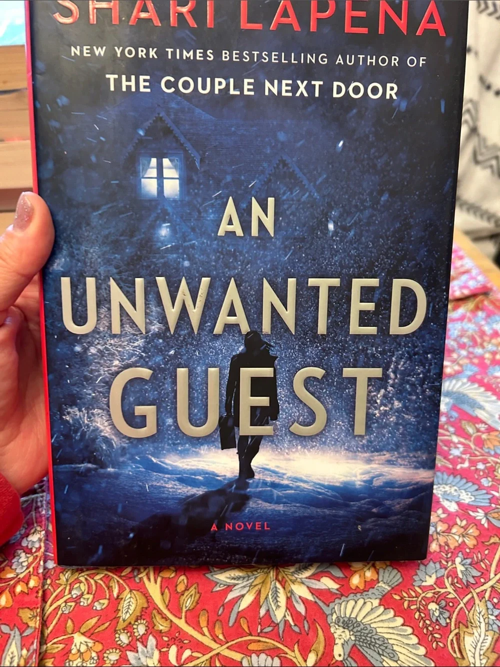 An Unwanted Guest by Shari Lapena Blue Hardcover Novel